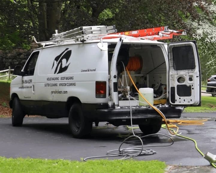 Painesville Power Washing professionals cleaning commercial fleet in Painesville